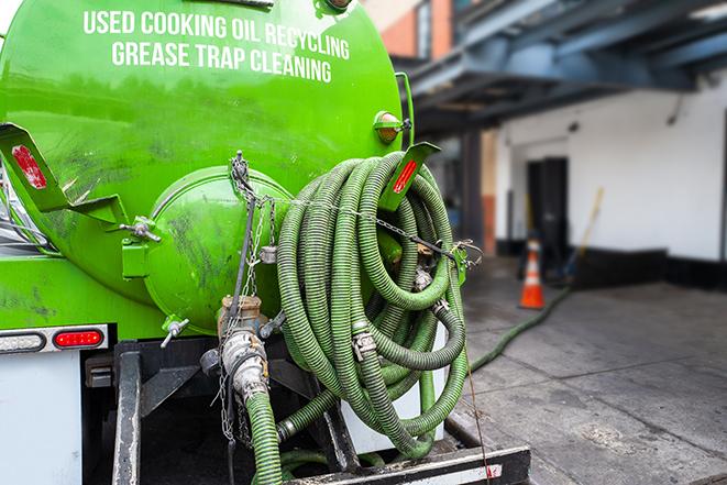 commercial kitchen grease trap being pumped out in Alvin